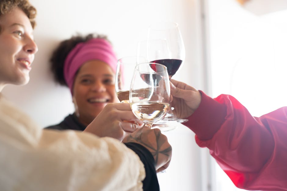 Group of friends joyously toasting with wine glasses, capturing a lively celebration mood.