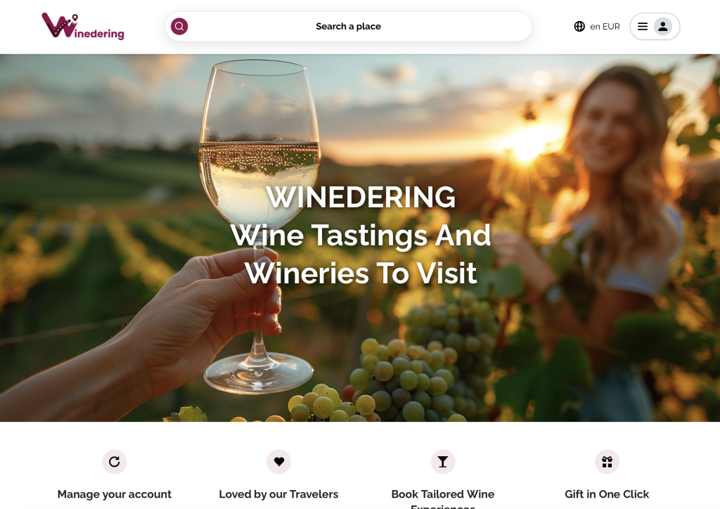 a person holds a glass of white wine among grapevines at sunset, with another person smiling in the blurred background. text on the image reads: “winedering wine tastings and wineries to visit—perfect for father's day wine gifts in the usa & uk.”.
