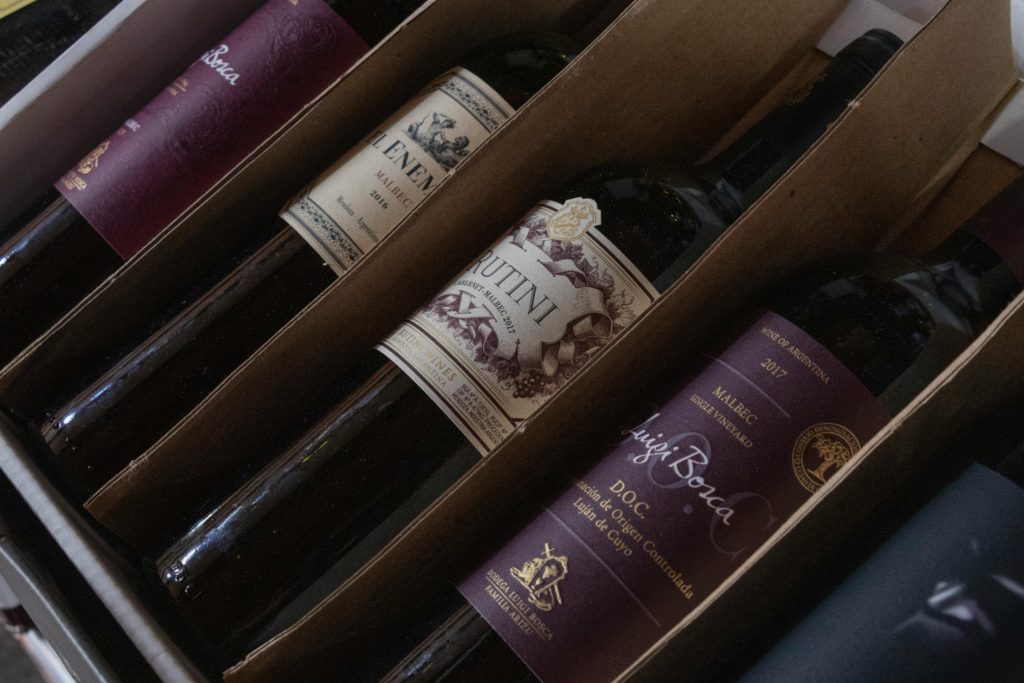 Best Wines for a Summer BBQ A selection of fine Argentinian wines in a box featuring various labels and vintages, perfect for wine enthusiasts.