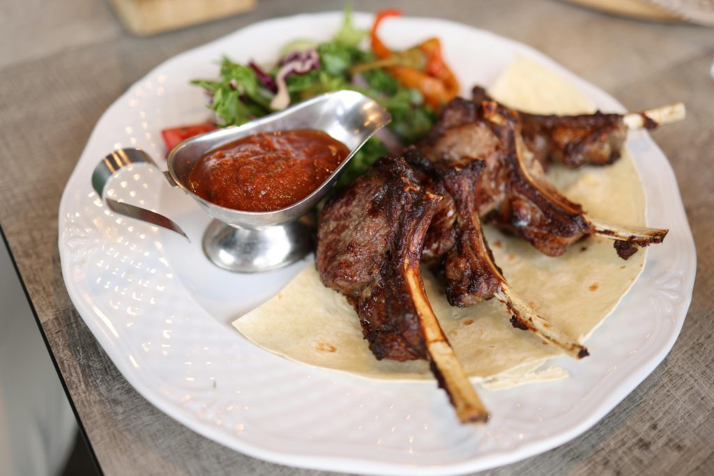 Wine and Lamb Pairing: The Definitive Guide Savor these succulent grilled lamb chops served with rich sauce and fresh salad.