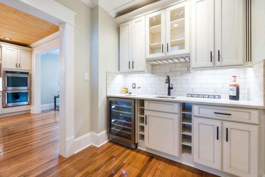 Bright modern kitchen highlighting elegant wooden cabinets and sleek design.