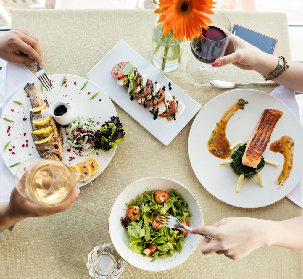 Wine and Salmon Pairing: The Complete Guide Top view of a gourmet seafood meal with wine and elegant plating.
