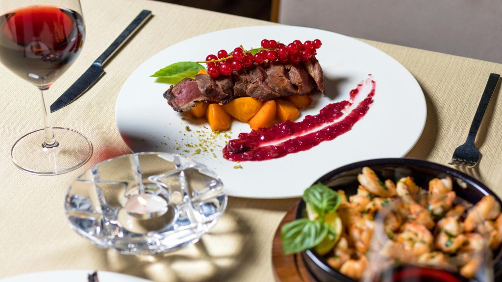 Wine and Steak Pairing: Best Bottles for Every Cut Delicious gourmet steak dinner with wine, served elegantly for fine dining.