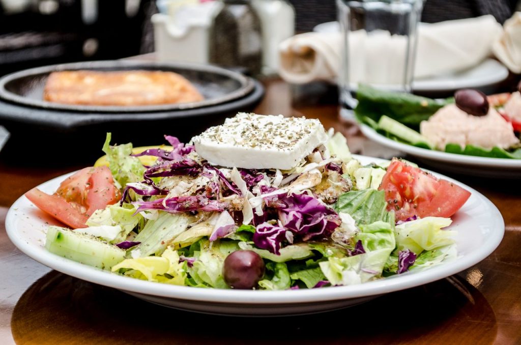 A delicious and colorful Greek salad with feta cheese, tomatoes, and olives, perfect for a healthy meal.